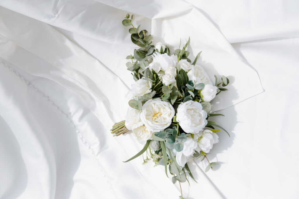 Bridal bouquet on bridal gown